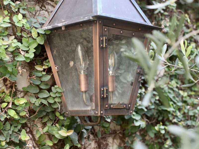 copper_lantern_green_wall_historic_courtyard