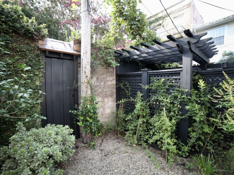 custom_carpentry_copper_accents_lattice_vine_outdoor_storage